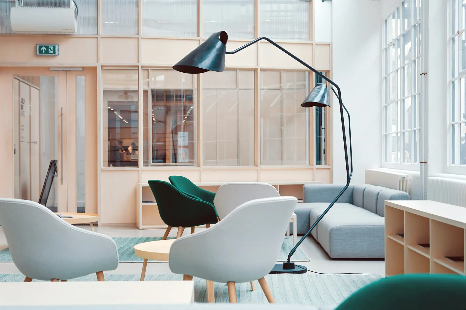 Bright workspace with a pale desk, chair, and large window