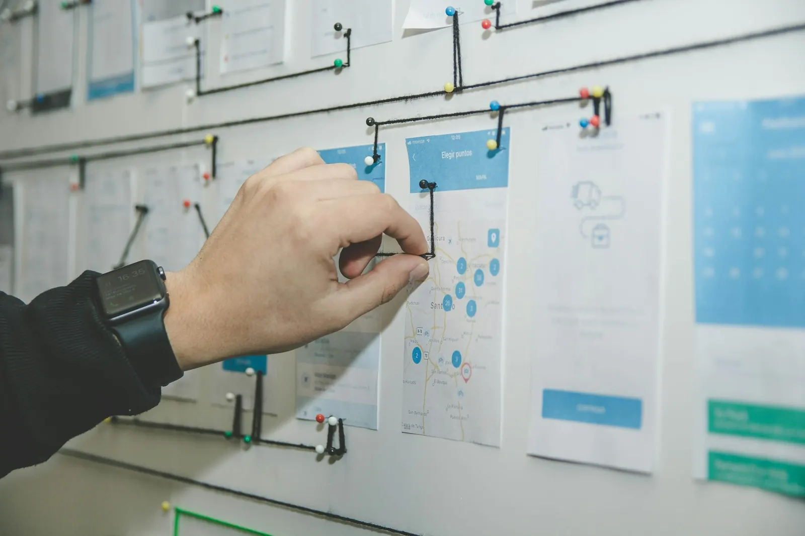 Hand writing on a wall-mounted planning board