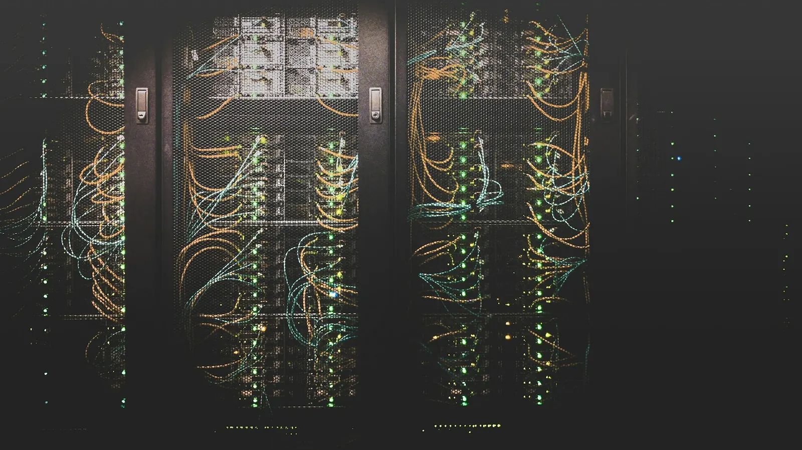 Rows of server racks with neatly dressed network cables